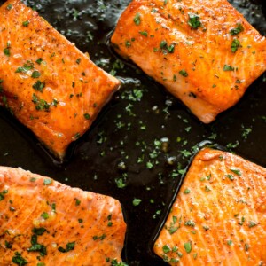This easy honey garlic salmon recipe is made right in your skillet in less than 20 minutes. The salmon is pan-fried to perfection, and the honey glaze is totally delicious!