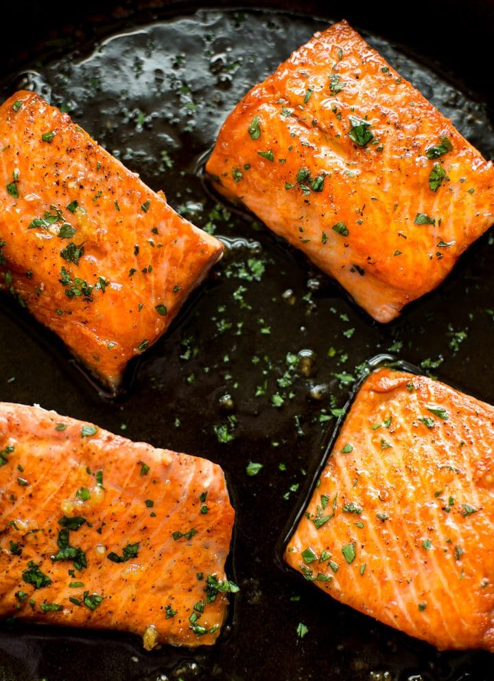 This easy honey garlic salmon recipe is made right in your skillet in less than 20 minutes. The salmon is pan-fried to perfection, and the honey glaze is totally delicious!