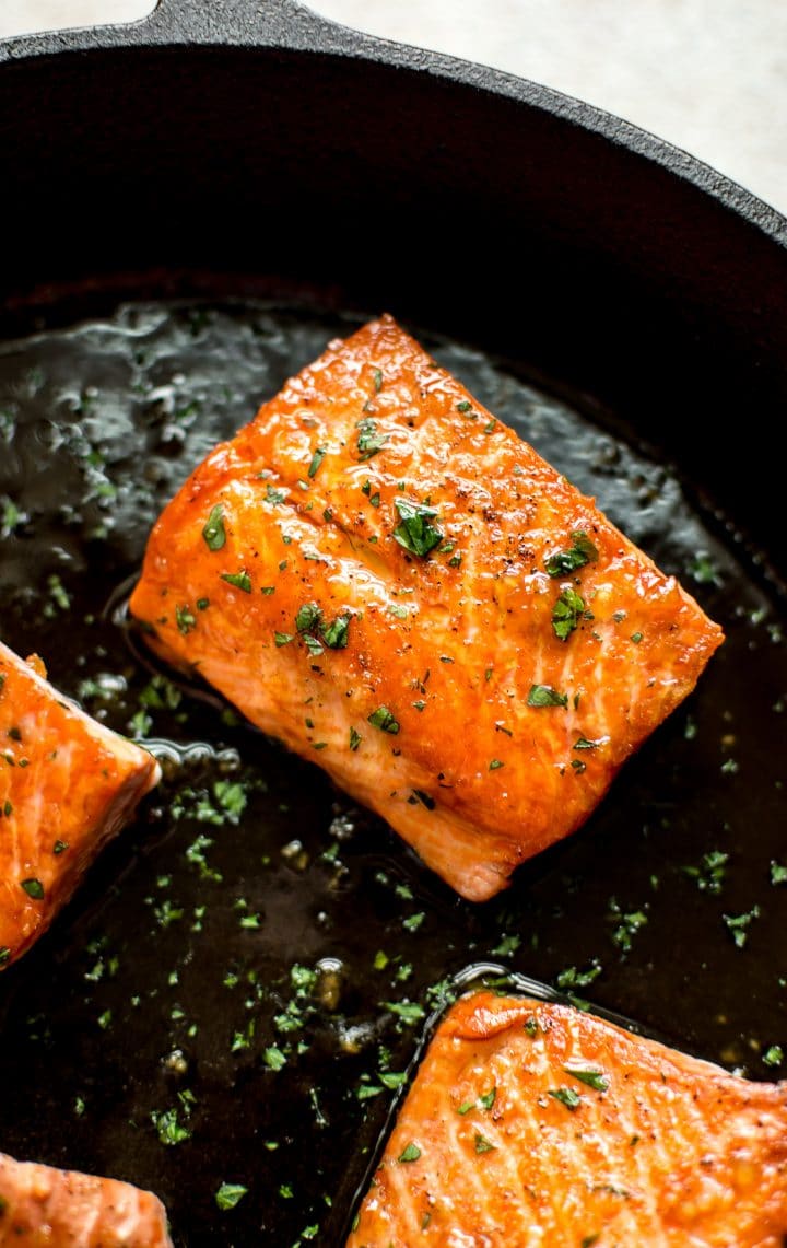 close-up of a piece of honey garlic salmon in a skillet