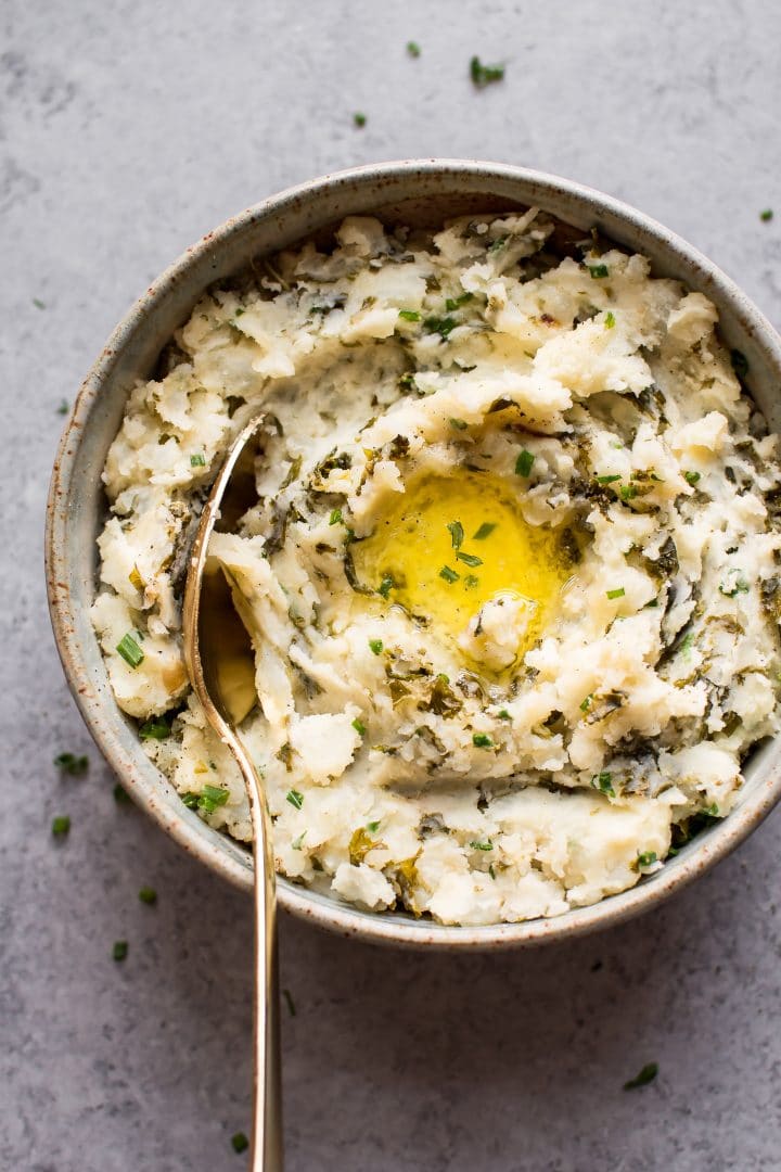 Colcannon Irish mashed potatoes and kale in a bowl with a spoon