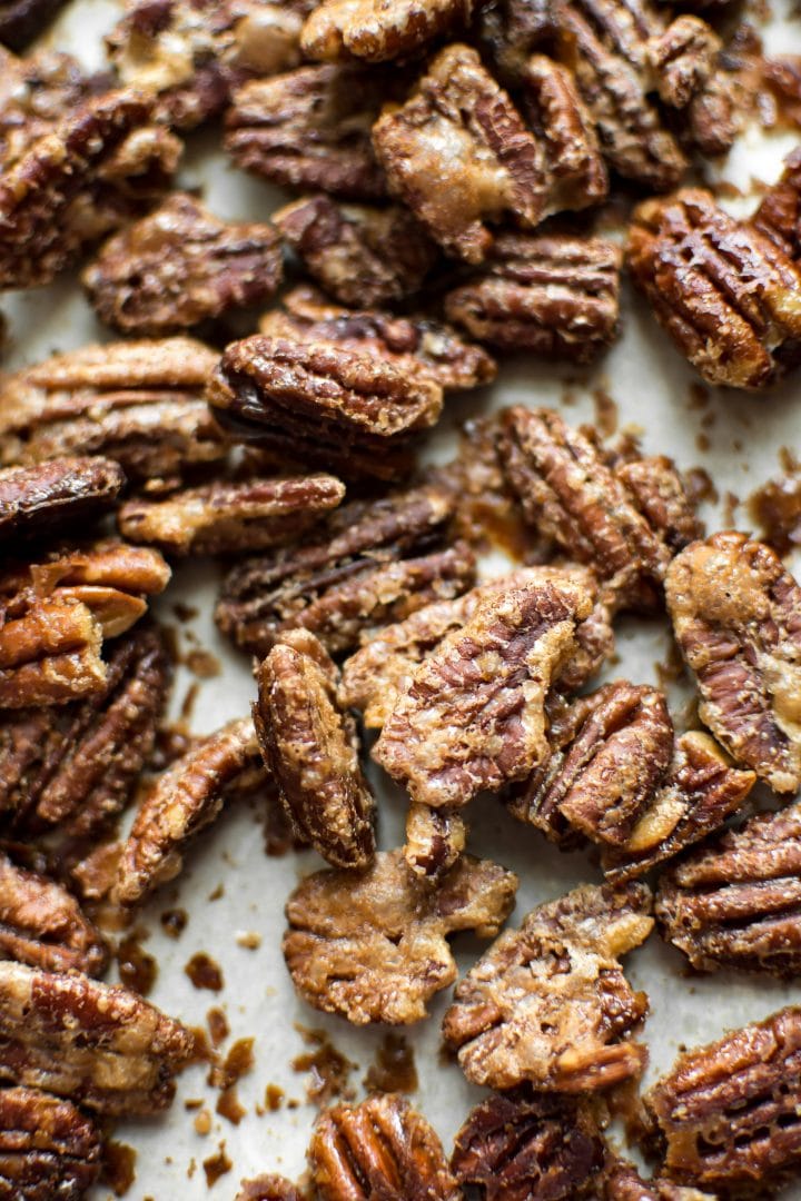 close-up of several candied maple roasted pecans