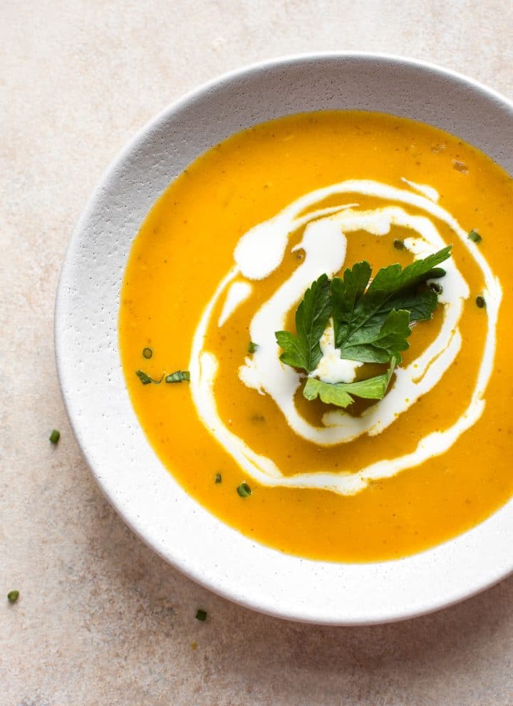 This easy vegan pumpkin soup from canned pumpkin is ready in under 30 minutes! A delicious and healthy dairy-free fall soup recipe.