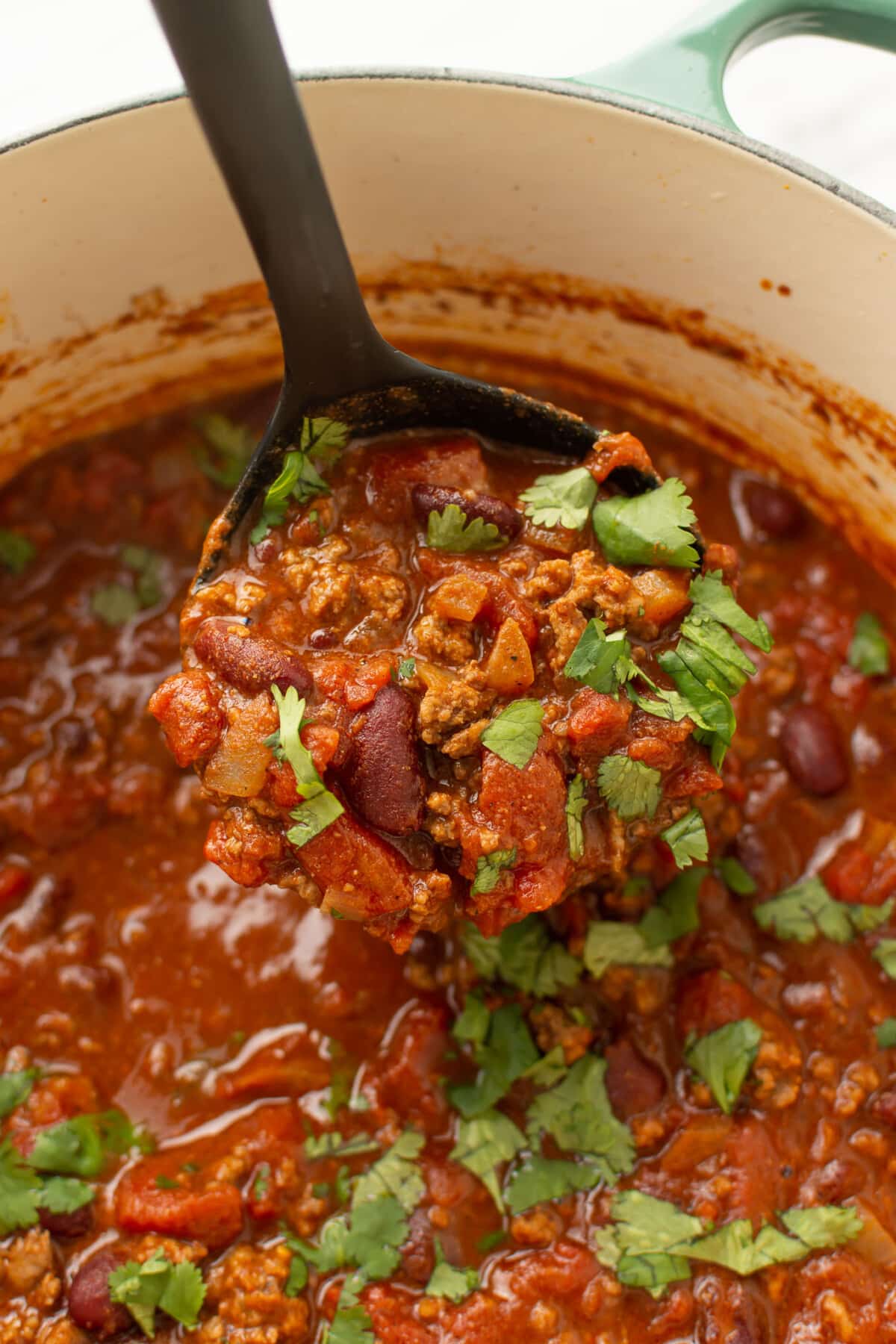 a pot of quick chili with a ladle