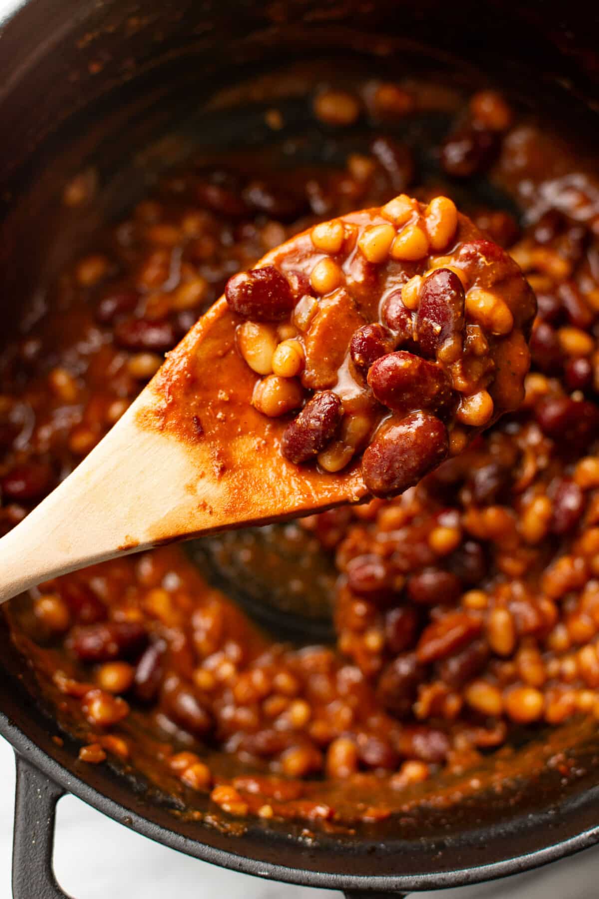 baked beans with a wooden spoon