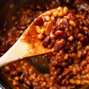 baked beans with a wooden spoon