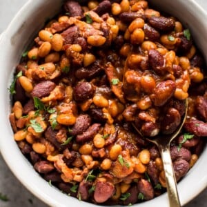 Easy homemade baked beans with bacon - a from scratch recipe that is perfect as a main course, side dish, or cookout/BBQ recipe. 