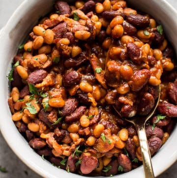 Easy homemade baked beans with bacon - a from scratch recipe that is perfect as a main course, side dish, or cookout/BBQ recipe.