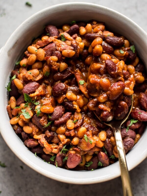 Easy homemade baked beans with bacon - a from scratch recipe that is perfect as a main course, side dish, or cookout/BBQ recipe. 