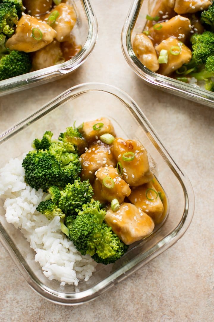 close-up of glass container with honey ginger meal prep bowls recipe with broccoli and rice