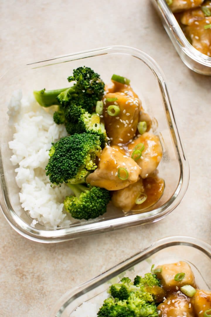 honey ginger meal prep bowls with broccoli and rice in a glass container close-up