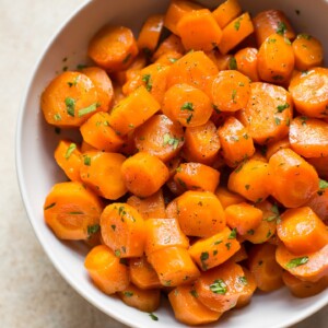 These delicious honey glazed carrots are easily roasted in the oven. They're sure to become a family favorite side dish recipe!