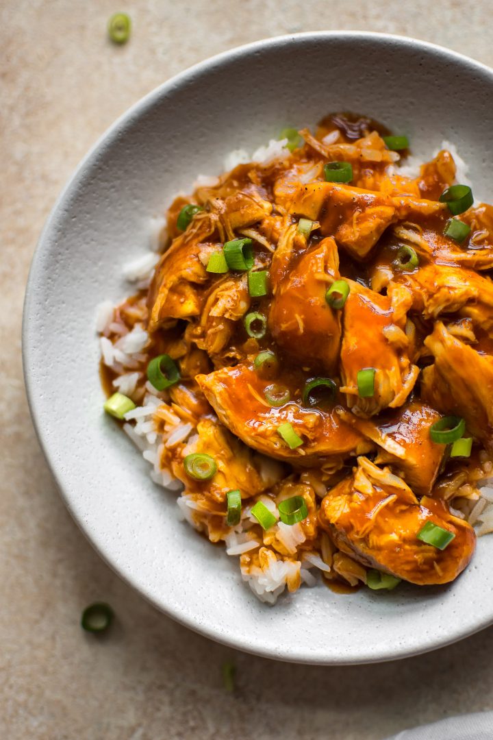 close-up Instant Pot sriracha chicken in a white bowl