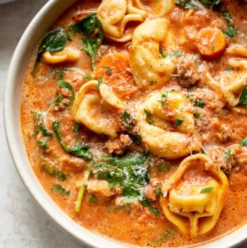 close-up of creamy slow cooker tortellini soup with sausage