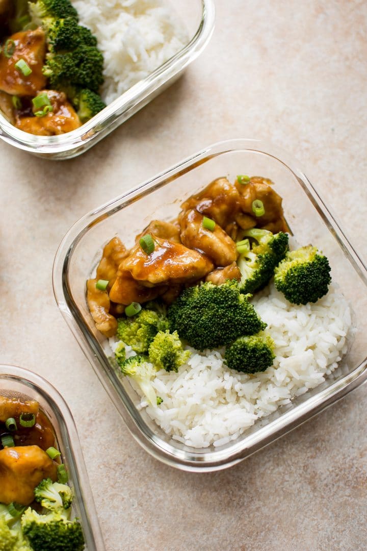 close-up of glass container with homemade teriyaki chicken, broccoli, and rice