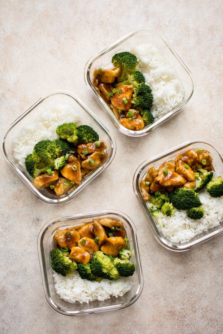 easy teriyaki chicken meal prep bowls with rice and broccoli in four glass containers