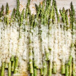 This easy cheesy baked asparagus recipe is the ultimate side dish! It only has a handful of everyday ingredients including parmesan, mozzarella, and garlic. This keto low carb recipe is a definite keeper!