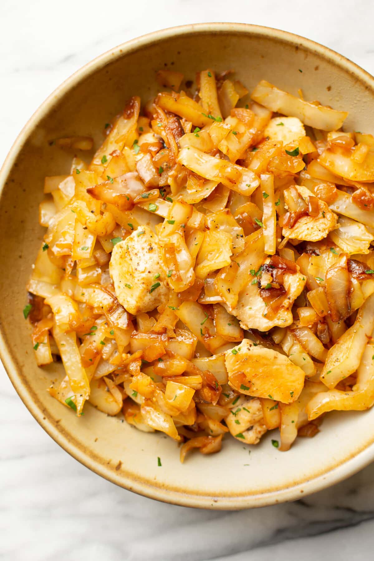 a bowl with chicken and cabbage stir fry