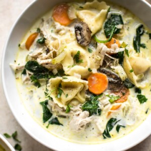 This easy creamy spinach tortellini soup is loaded with chicken, mushrooms, garlic, and carrots for amazing flavor that the whole family will love! 