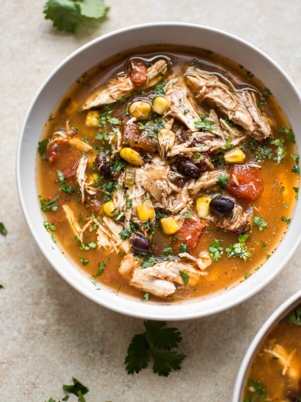 This easy Crockpot chipotle chicken soup is easy to make, spicy, and delicious! Corn, black beans, tender chicken, fire-roasted tomatoes, and chipotle chili peppers in adobo sauce make this one tasty soup.