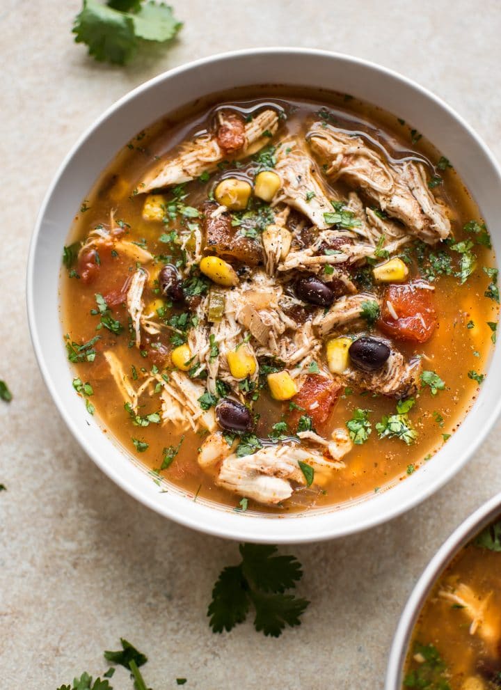 This easy Crockpot chipotle chicken soup is easy to make, spicy, and delicious! Corn, black beans, tender chicken, fire-roasted tomatoes, and chipotle chili peppers in adobo sauce make this one tasty soup.