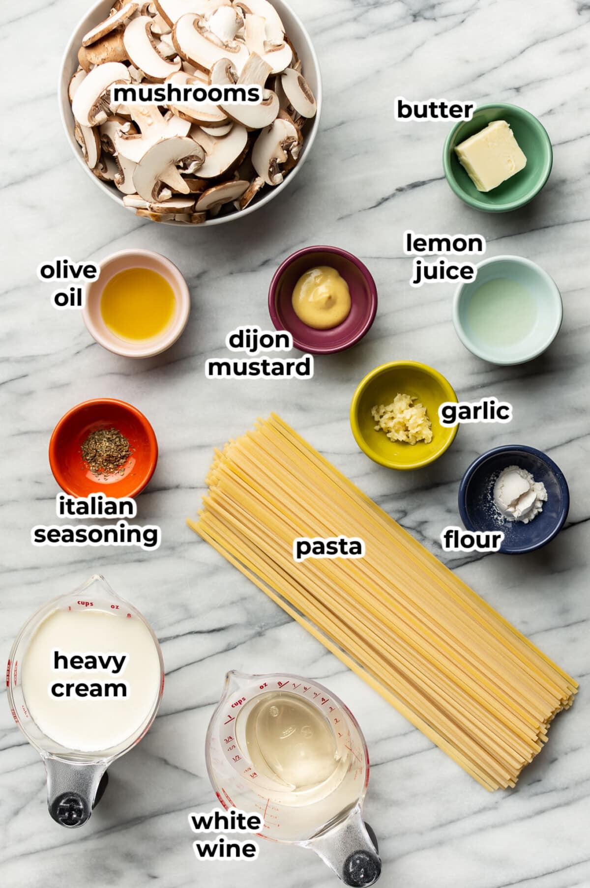 ingredients for creamy mushroom pasta in prep bowls