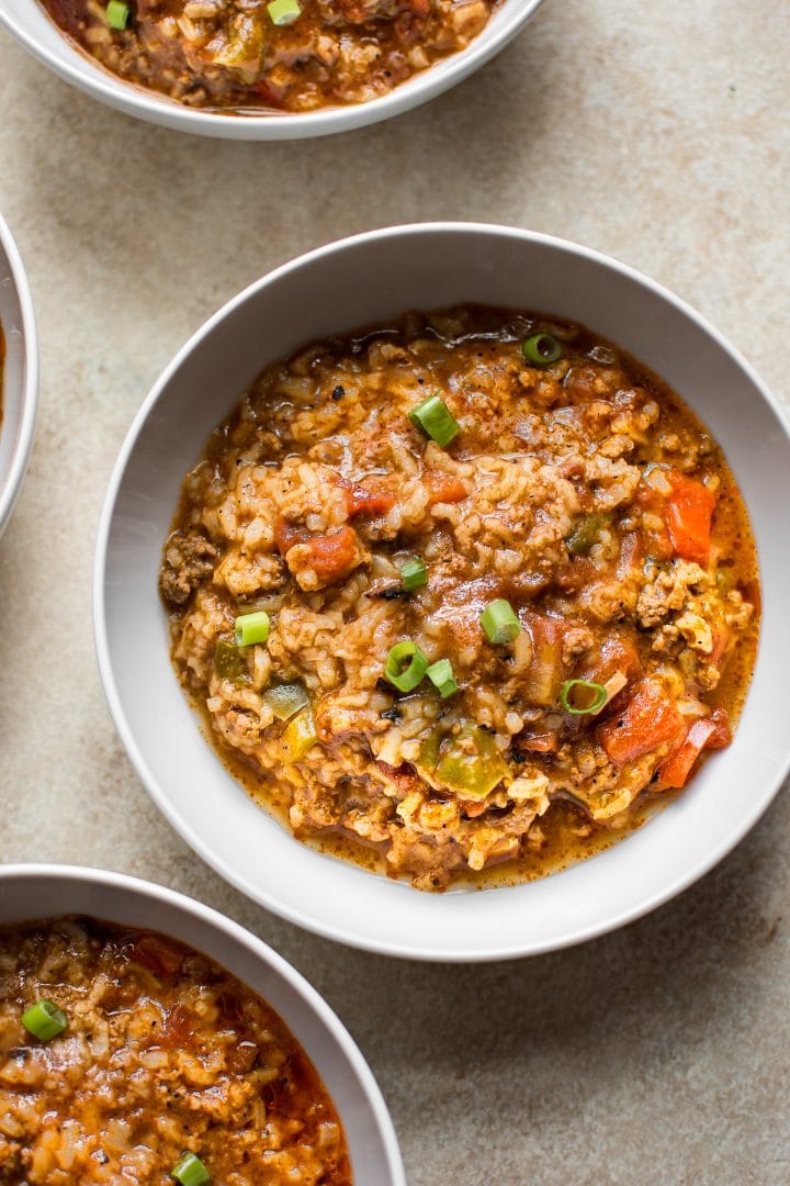 white bowl with Instant Pot stuffed pepper soup with beef, vegetables, and tomato broth