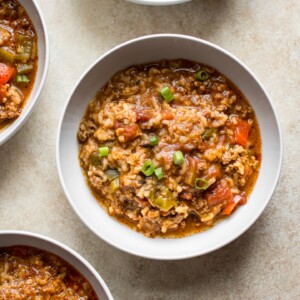 You'll love this easy stuffed pepper soup that's made right in your Instant Pot! This family friendly recipe has hearty ground beef, red and green bell peppers, rice, and fire-roasted tomatoes that make this one delicious and healthy meal.