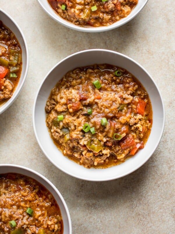 You'll love this easy stuffed pepper soup that's made right in your Instant Pot! This family friendly recipe has hearty ground beef, red and green bell peppers, rice, and fire-roasted tomatoes that make this one delicious and healthy meal.