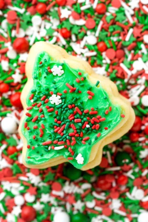 a christmas tree shaped no-fail sugar cookie with green icing and sprinkles