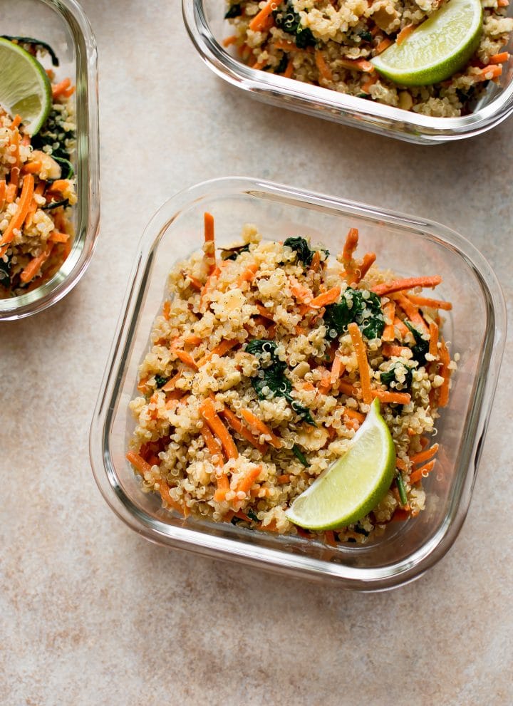 Want more plant based meals? These vegan meal prep bowls with spinach, carrots, quinoa, and a delicious light dressing are quick and easy. Great for meal prep beginners!