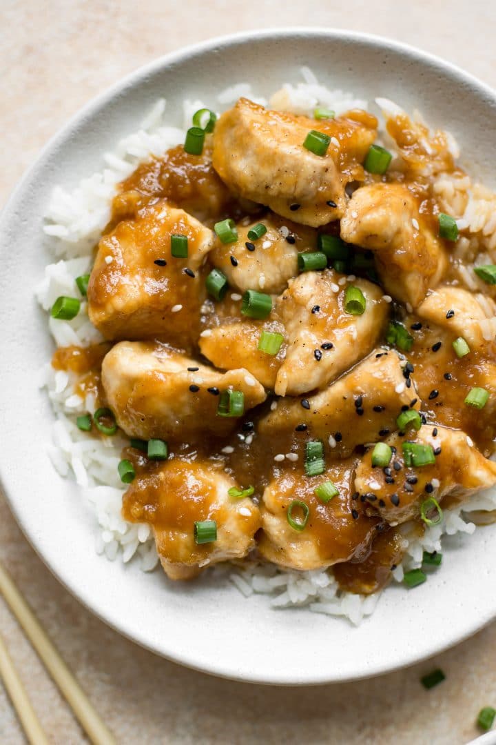 close-up of easy Mongolian chicken over rice in a white bowl