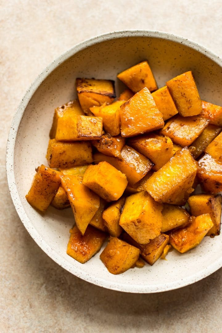 beige bowl with easy honey roasted butternut squash pieces