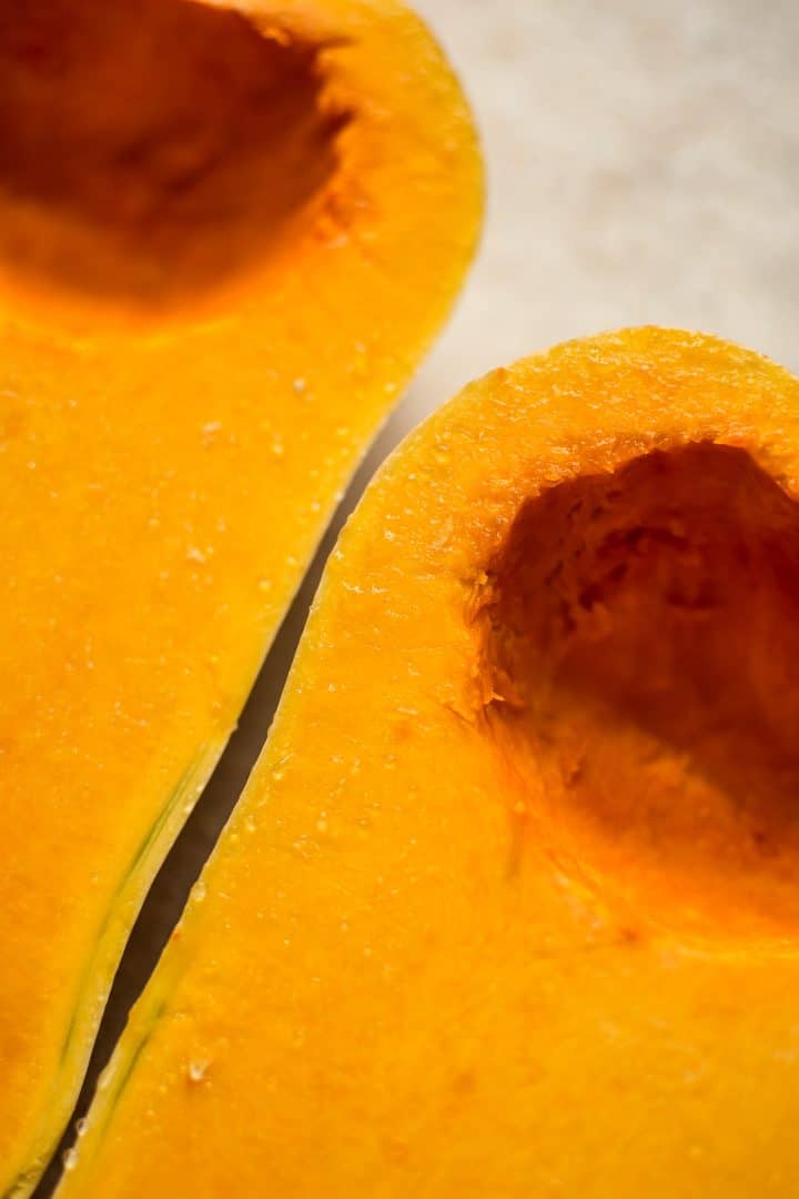 close-up of halved butternut squash with seeds scooped out