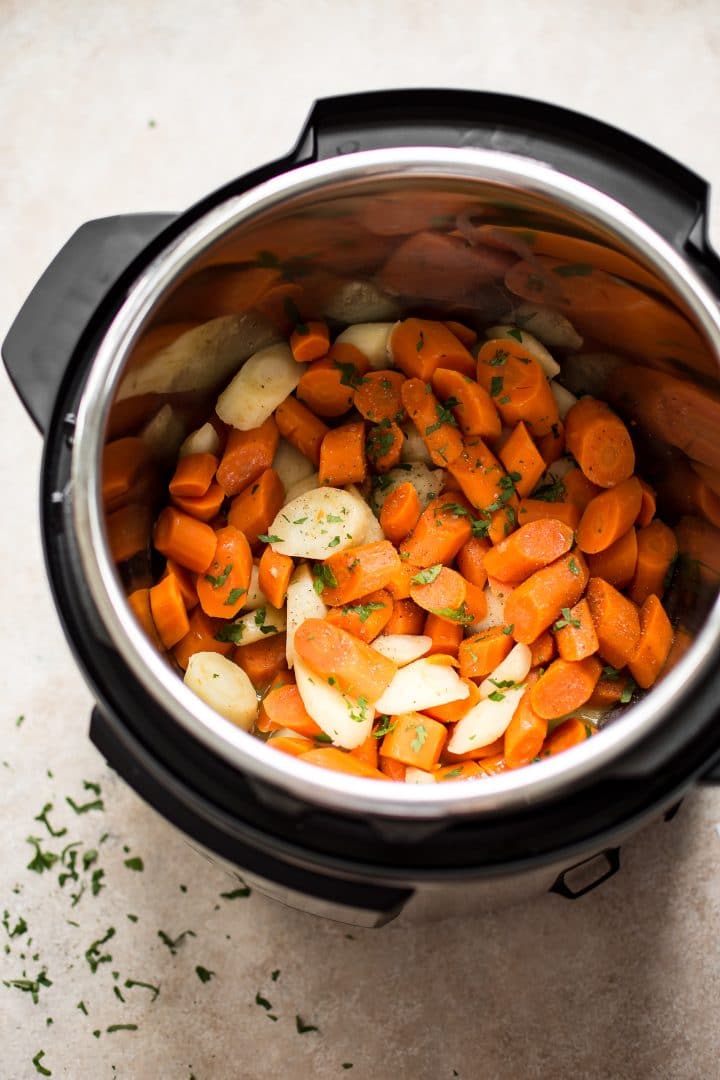 chopped parsnips and carrots inside an Instant Pot