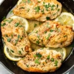 a skillet with lemon chicken