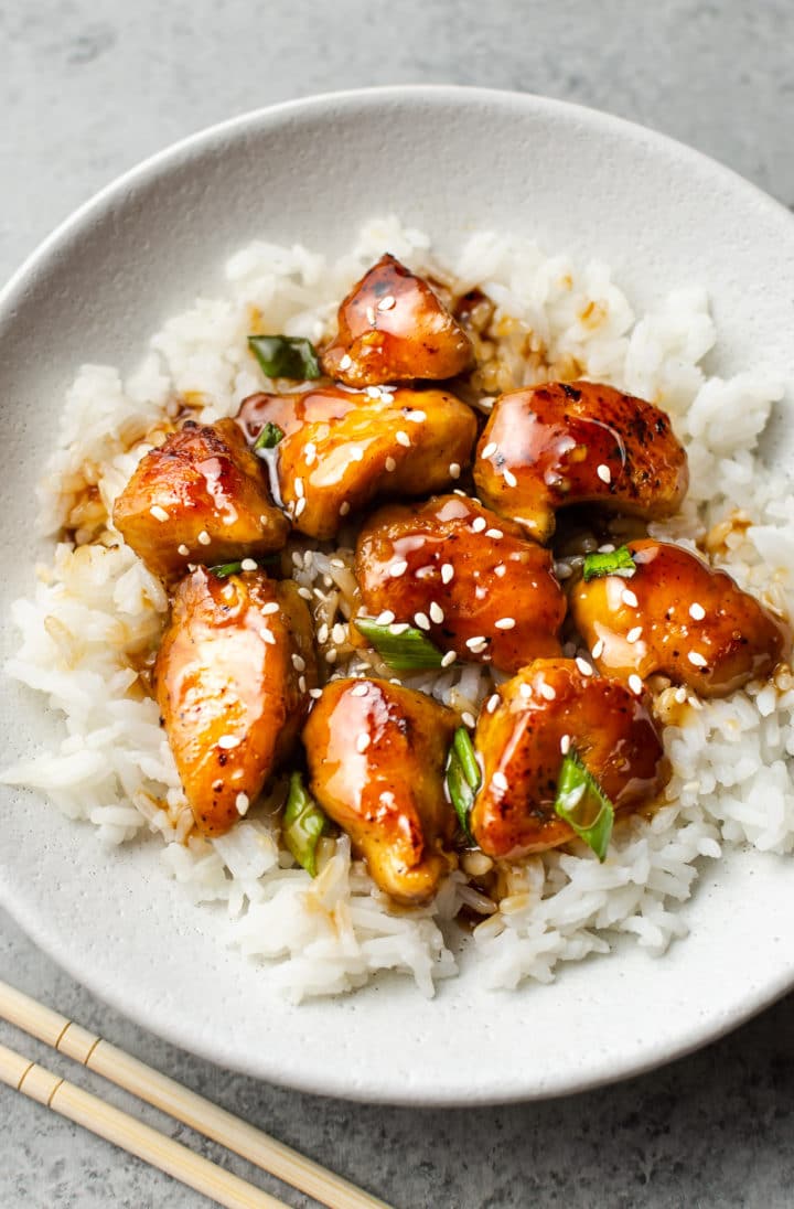 easy teriyaki chicken in a white bowl with rice