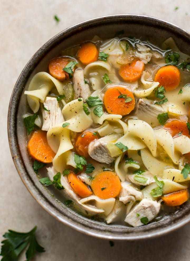 Quick and easy turkey noodle soup made from leftover turkey! The broth is super flavorful, healthy, and delicious.