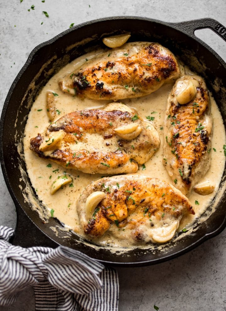 This easy creamy garlic chicken is a simple and incredibly delicious weeknight meal. The creamy garlic sauce with whole cloves of garlic will have you going back for seconds!