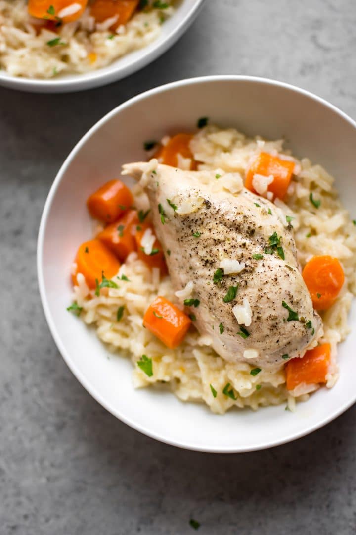 cozy Instant Pot chicken and rice with carrots in a white bowl