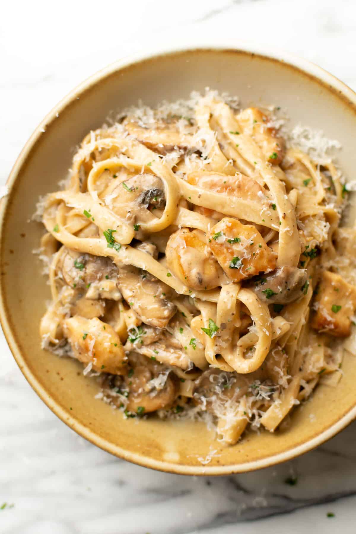 a bowl with chicken marsala fettuccine