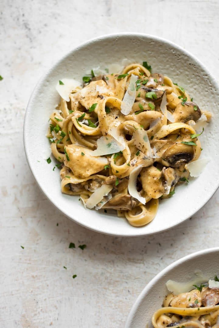 bowl of creamy chicken marsala recipe with mushrooms and tender chicken pieces served over pasta