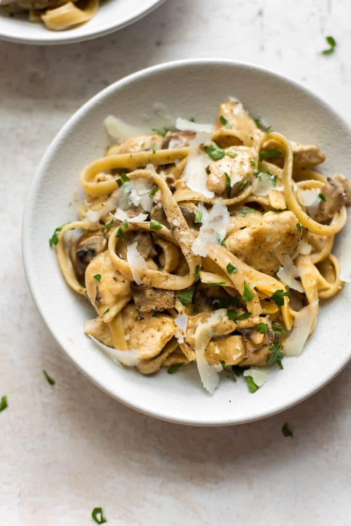 bowl of the best chicken marsala pasta with fresh parmesan