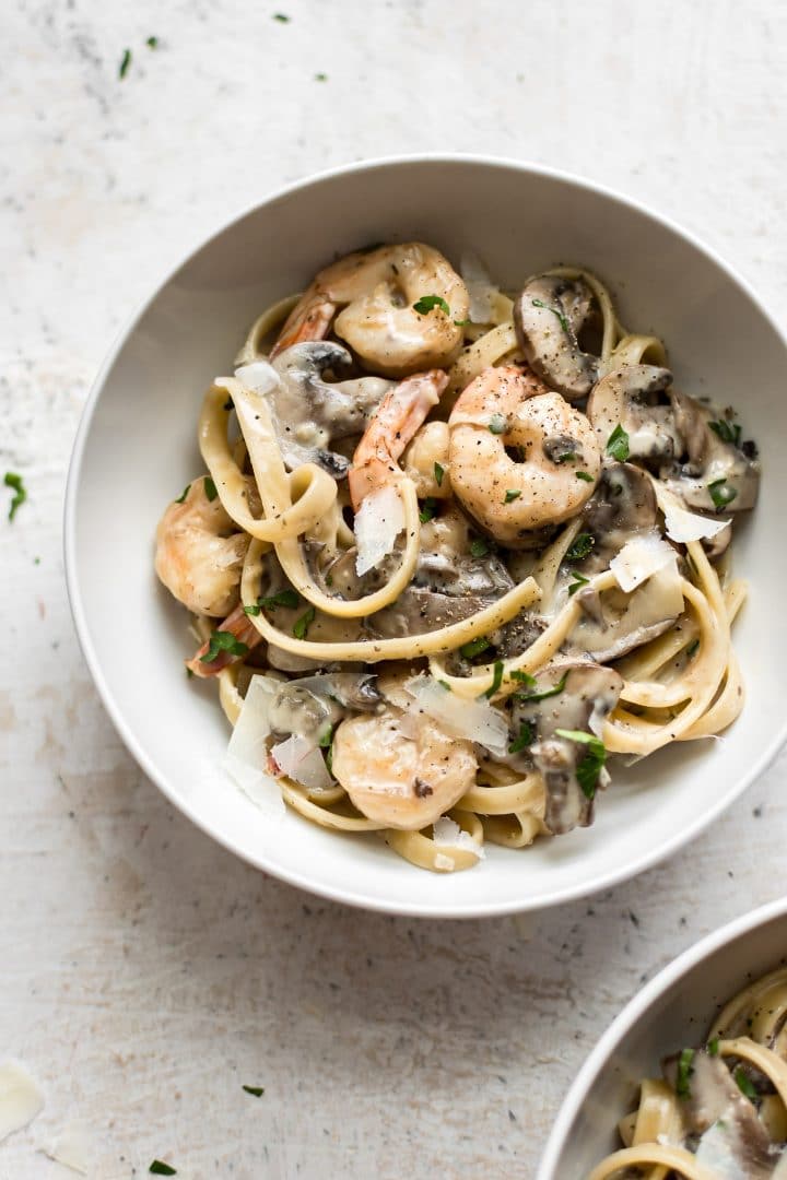 easy creamy shrimp and mushroom pasta in a white bowl