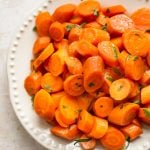 These slow cooker honey glazed carrots make the best easy side dish! Minimal prep and little effort yield delicious results. 