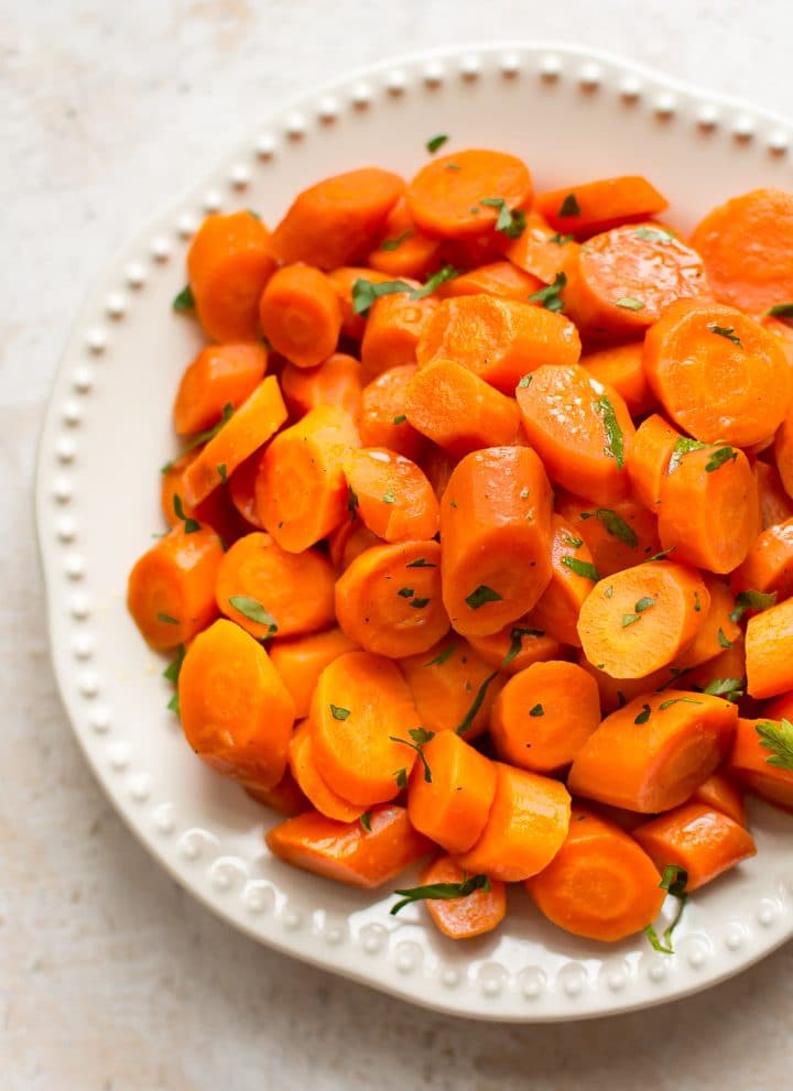 These slow cooker honey glazed carrots make the best easy side dish! Minimal prep and little effort yield delicious results. 