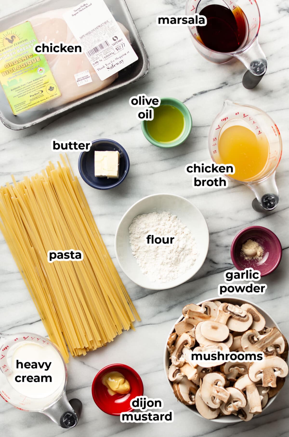 ingredients for chicken marsala pasta in prep bowls
