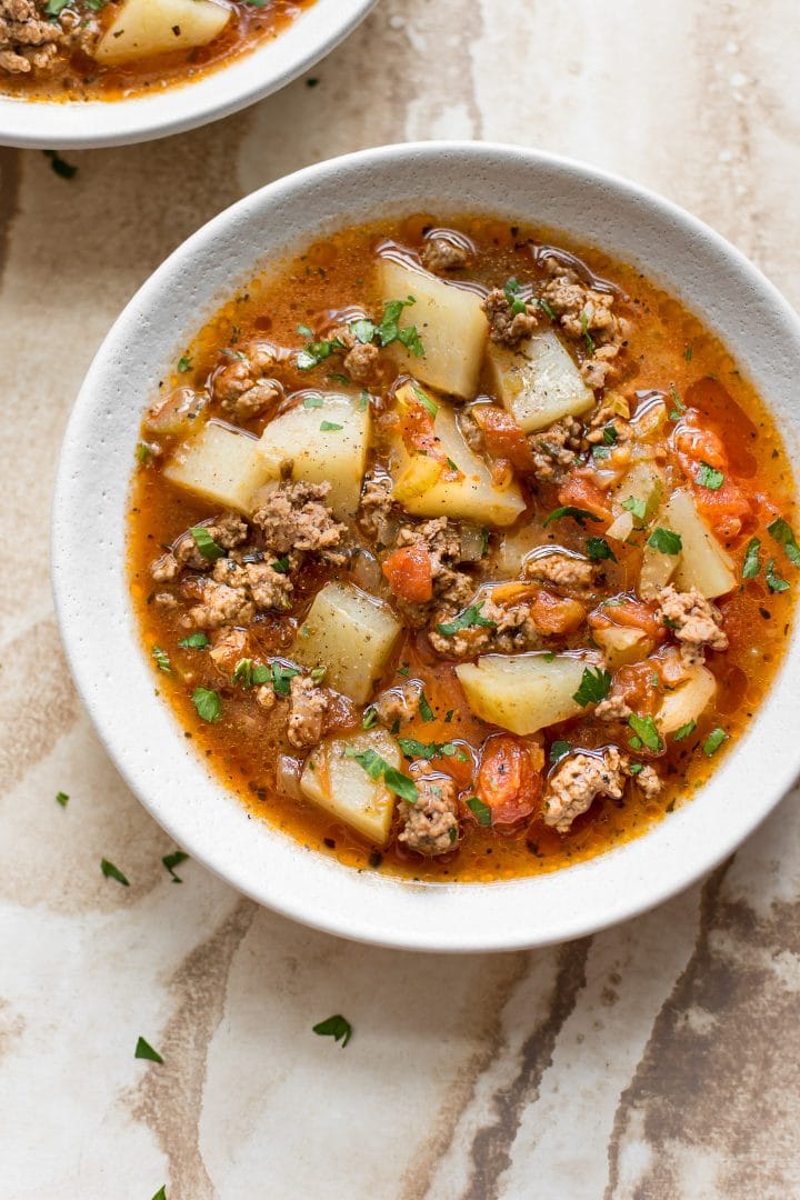 white bowl with Instant Pot ground beef tomato soup
