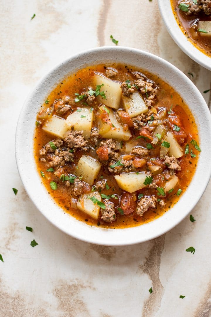 bowl of easy to make hamburger soup with lean ground beef, tomatoes, and potatoes