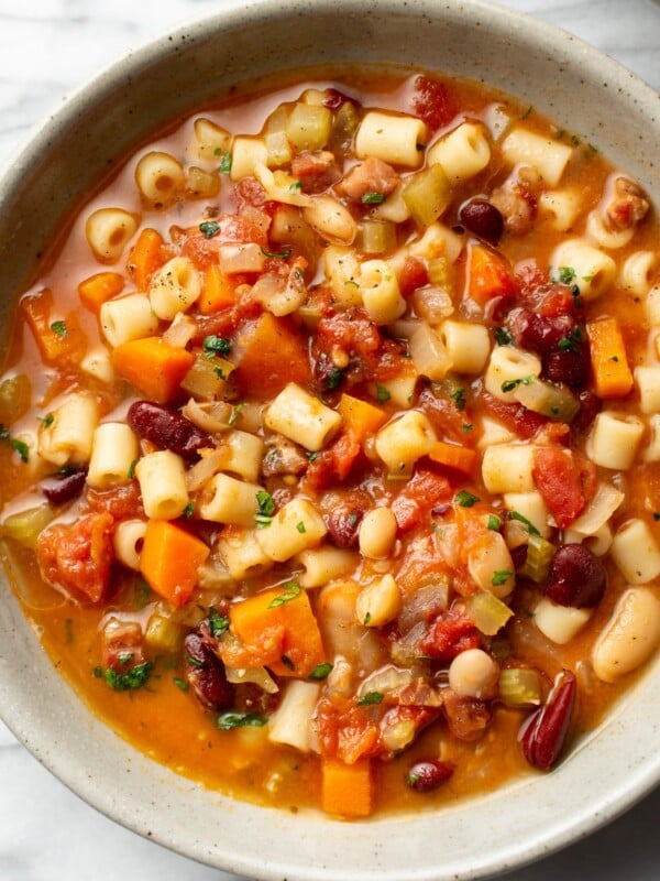 pasta e fagioli soup in a bowl on a marble surface