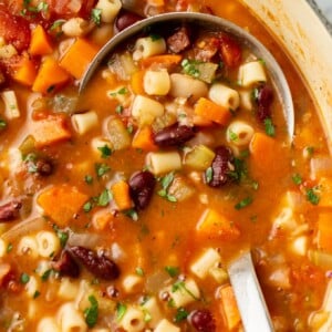 close-up of a ladle in a pot of soup